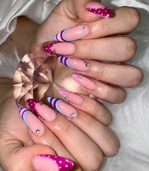 Pink almond nails with layered colour tips and crystals